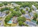 A lush, verdant community featuring a tennis court, pool, condos, and a pond with fountain at 4840 Moss Creek Loop # 38, Murrells Inlet, SC 29576