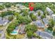A marked aerial view highlighting the location of the lush community with a pond and a pool at 4840 Moss Creek Loop # 38, Murrells Inlet, SC 29576