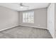 This bedroom features carpet flooring, closet, and a ceiling fan at 4840 Moss Creek Loop # 38, Murrells Inlet, SC 29576
