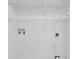 This laundry room features wire rack shelving and hook ups for the washer and dryer at 4840 Moss Creek Loop # 38, Murrells Inlet, SC 29576