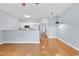 An open floor plan highlights this living room with hardwood floors and updated, eat-in kitchen at 4840 Moss Creek Loop # 38, Murrells Inlet, SC 29576