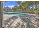 Community pool and lounge area surrounded by a white fence and mature trees at 4840 Moss Creek Loop # 38, Murrells Inlet, SC 29576