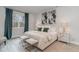 Beautifully staged bedroom with a king sized bed, large window, and decorative side tables at 501 Haven View Way, Murrells Inlet, SC 29576