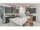 Modern kitchen featuring granite countertops, dark cabinets, and stainless steel appliances at 501 Haven View Way, Murrells Inlet, SC 29576