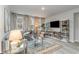 Bright living room with large windows, modern decor, and comfortable seating at 501 Haven View Way, Murrells Inlet, SC 29576