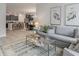Open concept living area with stylish furnishings and view of kitchen with breakfast bar at 501 Haven View Way, Murrells Inlet, SC 29576
