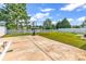 Large concrete patio and expansive backyard area with basketball hoop and white picket fence at 5031 Medieval Dr., Conway, SC 29526