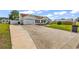 Single-story home with an attached garage and well-kept lawn at 5031 Medieval Dr., Conway, SC 29526