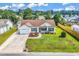 Charming single-story home with a well-manicured lawn, attached garage, and welcoming front porch at 5031 Medieval Dr., Conway, SC 29526