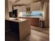 Well-lit kitchen with stainless steel appliances, stylish backsplash, and white countertops at 5031 Medieval Dr., Conway, SC 29526