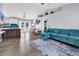 Open-concept living room and kitchen area featuring a vaulted ceiling, modern decor, and lots of light at 5031 Medieval Dr., Conway, SC 29526