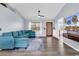 Cozy living room with a large sectional sofa, hardwood floors, a ceiling fan, and a mounted television at 5031 Medieval Dr., Conway, SC 29526