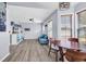 Inviting living room with wood floors, a blue couch, and a ceiling fan at 5031 Medieval Dr., Conway, SC 29526