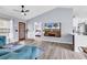Open-concept living space with a modern door, TV, and view into the bedroom at 5031 Medieval Dr., Conway, SC 29526
