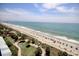 Scenic aerial view of the beach, ocean, and beautifully landscaped grounds at 504 N Ocean Blvd. # 1106, Myrtle Beach, SC 29577