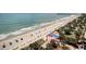 Picturesque aerial view of beach featuring colorful beach umbrellas and lush palms at 504 N Ocean Blvd. # 1106, Myrtle Beach, SC 29577