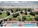 Overhead shot showcasing the beachside amenities including a pool, lush palms, and greenspace at 504 N Ocean Blvd. # 1106, Myrtle Beach, SC 29577