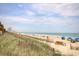 Picturesque beach view with sandy shore, ocean waves, and a skyline in the distance at 504 N Ocean Blvd. # 1106, Myrtle Beach, SC 29577