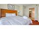 Inviting bedroom boasts a king bed and a glimpse of an attached bathroom at 504 N Ocean Blvd. # 1106, Myrtle Beach, SC 29577
