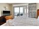 Bright bedroom with a sliding glass door that leads to an oceanfront balcony at 504 N Ocean Blvd. # 1106, Myrtle Beach, SC 29577