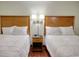 Relaxing bedroom featuring two beds, soft lighting, and comfortable bedding at 504 N Ocean Blvd. # 1106, Myrtle Beach, SC 29577