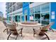 Enjoy the outdoors with this fire pit surrounded by comfortable chairs at a resort with pool access at 504 N Ocean Blvd. # 1106, Myrtle Beach, SC 29577