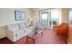 Relaxing living room featuring an ocean view balcony, sofa, and sitting chairs at 504 N Ocean Blvd. # 1106, Myrtle Beach, SC 29577