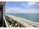 Expansive ocean view from the balcony, capturing the beach, palm trees, and the horizon at 504 N Ocean Blvd. # 1106, Myrtle Beach, SC 29577