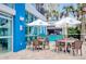 Outdoor dining area with tables, umbrellas, and a bar for a relaxing experience in a resort setting at 504 N Ocean Blvd. # 1106, Myrtle Beach, SC 29577