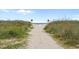 Scenic beach access path with natural dunes and ocean views at 5409 N Ocean Blvd. # 100, North Myrtle Beach, SC 29582
