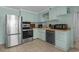 Well-lit kitchen with stainless steel appliances and ample counter space at 5409 N Ocean Blvd. # 100, North Myrtle Beach, SC 29582