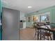Cozy dining area adjacent to a kitchen featuring stainless steel appliances and ample natural light at 5409 N Ocean Blvd. # 100, North Myrtle Beach, SC 29582