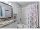 Well-lit bathroom featuring a vanity with a marble countertop and a shower/tub combination at 6001 - 1082 S Kings Hwy., Myrtle Beach, SC 29575