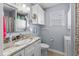 Well-lit bathroom featuring a vanity with a marble countertop, and a stacked washer/dryer at 6001 - 1082 S Kings Hwy., Myrtle Beach, SC 29575