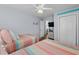 Comfortable bedroom featuring twin beds, striped bedding, and a ceiling fan at 6001 - 1082 S Kings Hwy., Myrtle Beach, SC 29575
