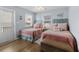 Charming bedroom with two beds, coastal-themed decor, and a view of the outdoors at 6001 - 1082 S Kings Hwy., Myrtle Beach, SC 29575
