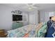 Comfortable bedroom featuring coastal-themed bedding, wood flooring, and a ceiling fan at 6001 - 1082 S Kings Hwy., Myrtle Beach, SC 29575