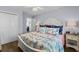 Inviting bedroom with coastal-themed bedding, and a doorway leading to the living area at 6001 - 1082 S Kings Hwy., Myrtle Beach, SC 29575