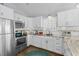 Updated kitchen with stainless steel appliances and bright, white cabinetry at 6001 - 1082 S Kings Hwy., Myrtle Beach, SC 29575