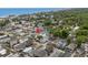 Aerial view showcases the home in a coastal neighborhood with lush trees and ocean views at 6001-1453 S Kings Hwy., Myrtle Beach, SC 29575