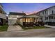 Charming home featuring a lovely front porch and a well-maintained yard, set against a colorful dusk sky at 6001-1453 S Kings Hwy., Myrtle Beach, SC 29575