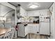 Efficient kitchen features white cabinetry, wood counters, and compact appliances for easy meal preparation at 6001-1453 S Kings Hwy., Myrtle Beach, SC 29575