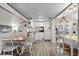 Cozy eat-in kitchen with wood floors and white cabinetry, offering a charming and functional space at 6001-1453 S Kings Hwy., Myrtle Beach, SC 29575