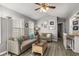 Comfortable living room with stylish furnishings, complemented by nautical décor and a ceiling fan at 6001-1453 S Kings Hwy., Myrtle Beach, SC 29575