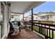 Cozy covered porch with comfortable seating, offering a relaxing outdoor space with views of the neighborhood at 6001-1453 S Kings Hwy., Myrtle Beach, SC 29575