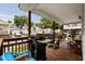 Inviting covered porch with outdoor seating, grill, and lovely views of the surrounding community at 6001-1453 S Kings Hwy., Myrtle Beach, SC 29575