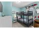 Nautical themed bunk room with light blue walls, bunk beds, and decorative elements, a fun and cozy space at 6001-1808 S Kings Hwy., Myrtle Beach, SC 29575