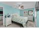 Bright bedroom with light blue walls, white furniture, and nautical-themed decor, exuding a tranquil vibe at 6001-1808 S Kings Hwy., Myrtle Beach, SC 29575