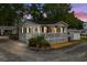 Charming beach cottage with a lovely front porch and landscaped yard at 6001-1808 S Kings Hwy., Myrtle Beach, SC 29575