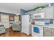 Well-equipped kitchen with stainless steel appliances, white cabinets, and adjacent dining area at 6001-N2 S Kings Hwy., Myrtle Beach, SC 29575
